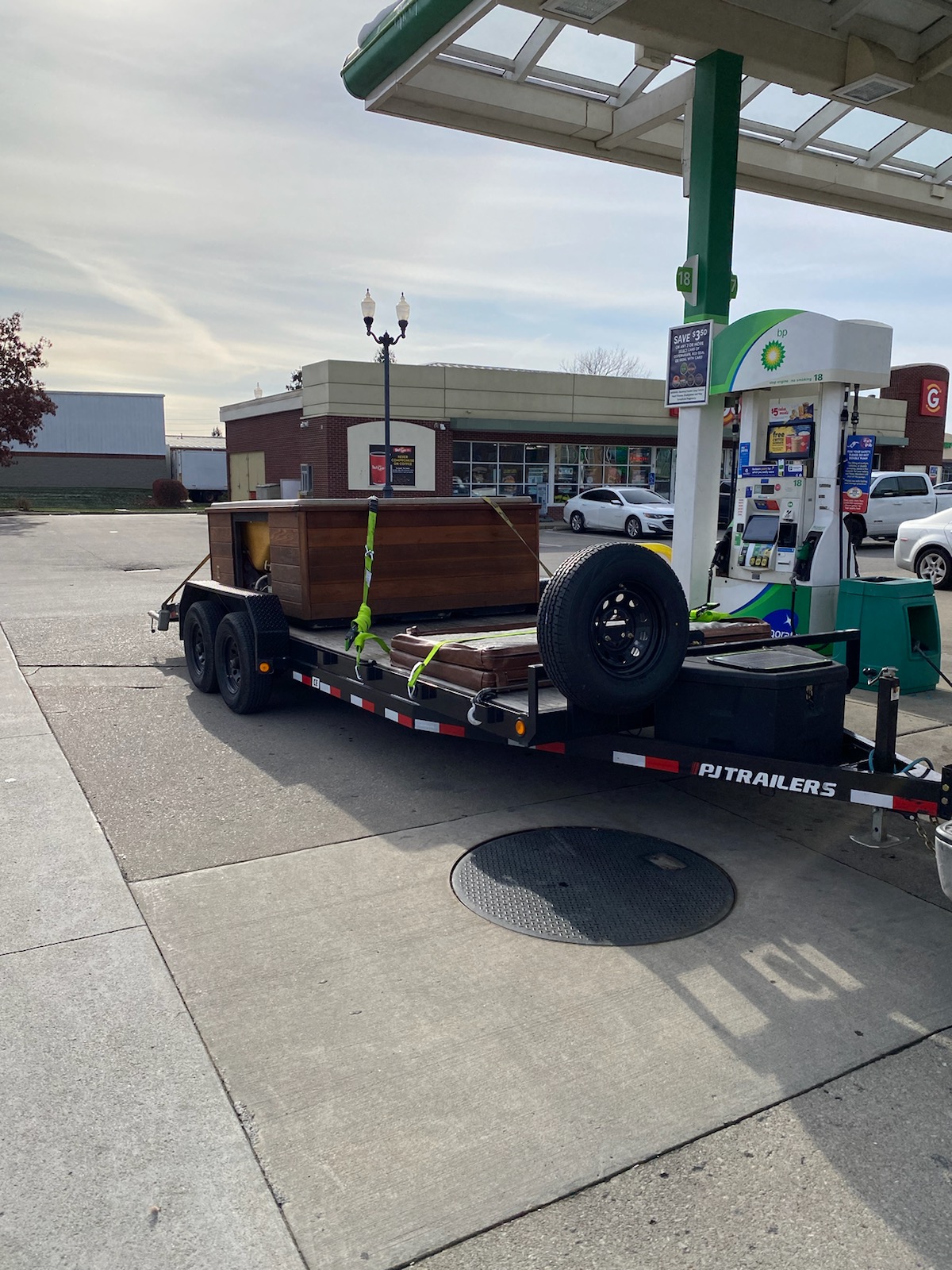 PJ Trailers flatbed with cargo box secured for general hauling service in Greenfield, IN