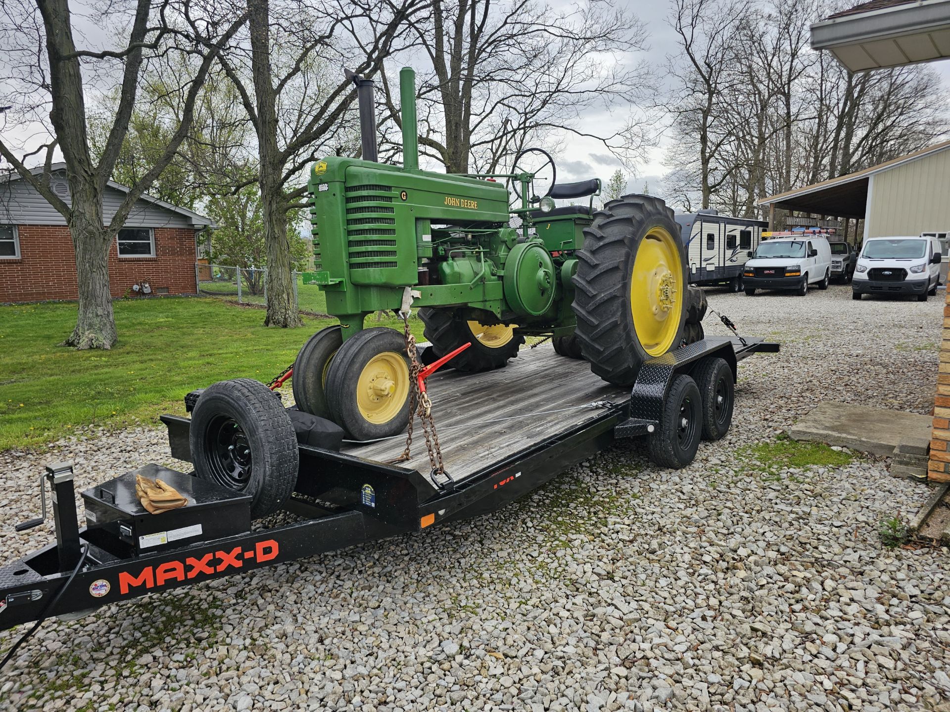 John Deere tractor secured on MAXX-D flatbed trailer rental for farm equipment transport in Greenfield, IN